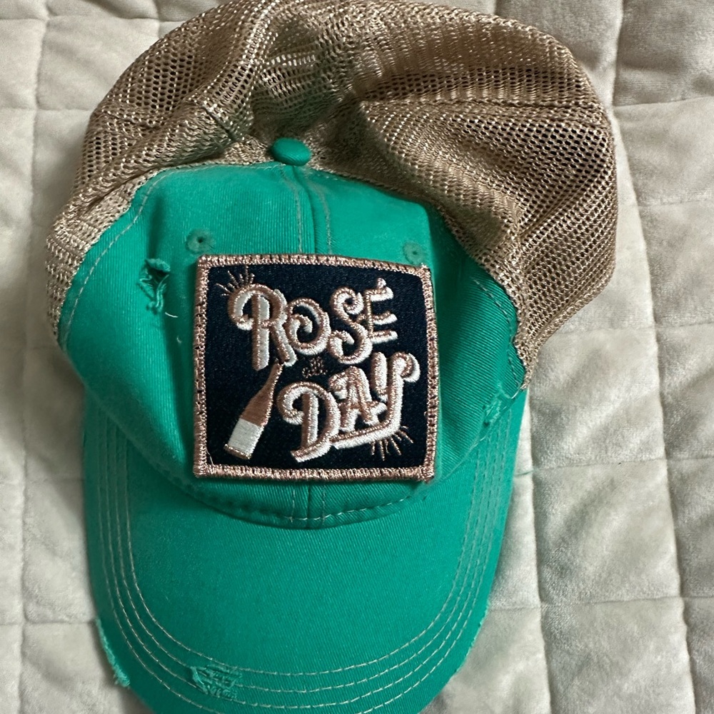 Judith March “Rose all day” trucker hat.